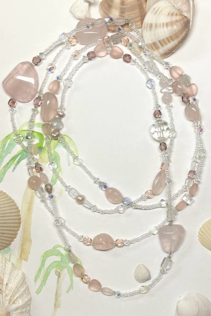The Serendipity Necklace is a beautiful gentle pink rose quartz, with an assemblage of new, old and repurposed stones, each stone has a story to tell and together they are a powerful link to what was and what is to come.