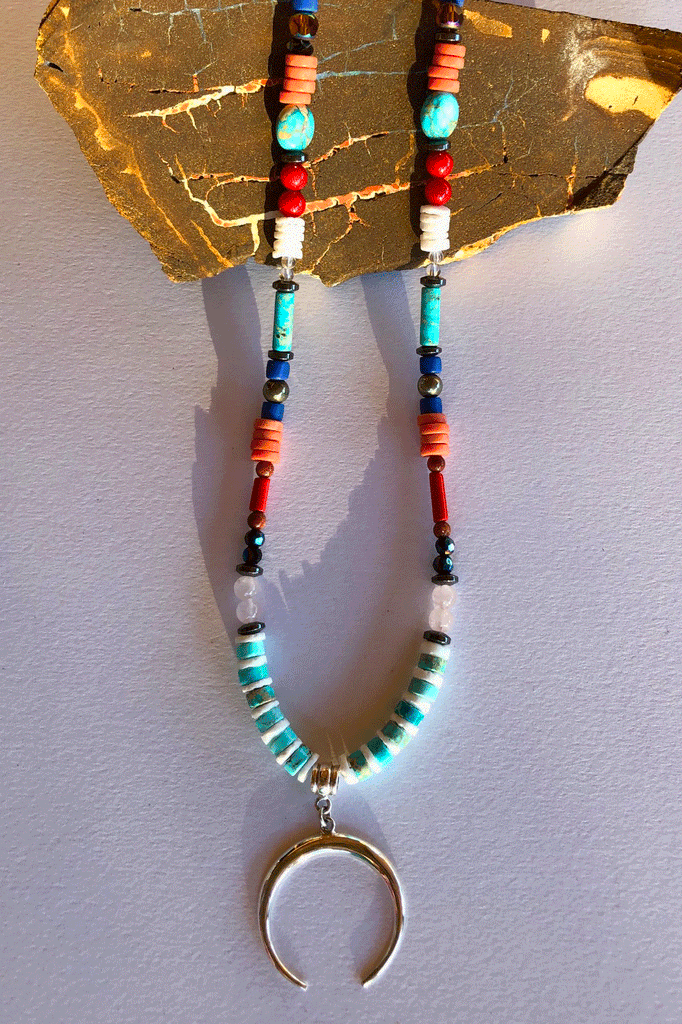 A powerful gemstone necklace with natural stones. Perfect to wear with chic boho luxe clothing an exclusive design