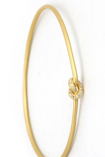 This adorable bangle has Luna appeal it is handcrafted in gold plated  silver vermeil. The gems are studded randomly and will sparkle at different angles