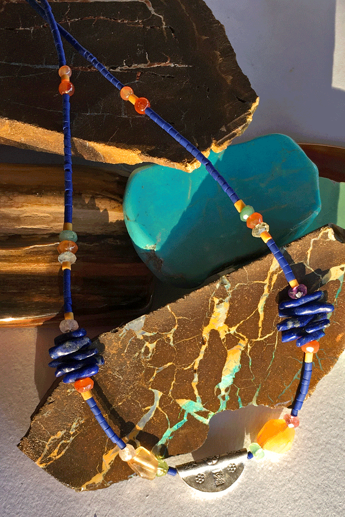 Necklace Cay Amulet with Lapis Lazuli is 40cm in length Beads include Lapis Lazuli, carnelian, faceted semi precious stone and Turkish glass beads.