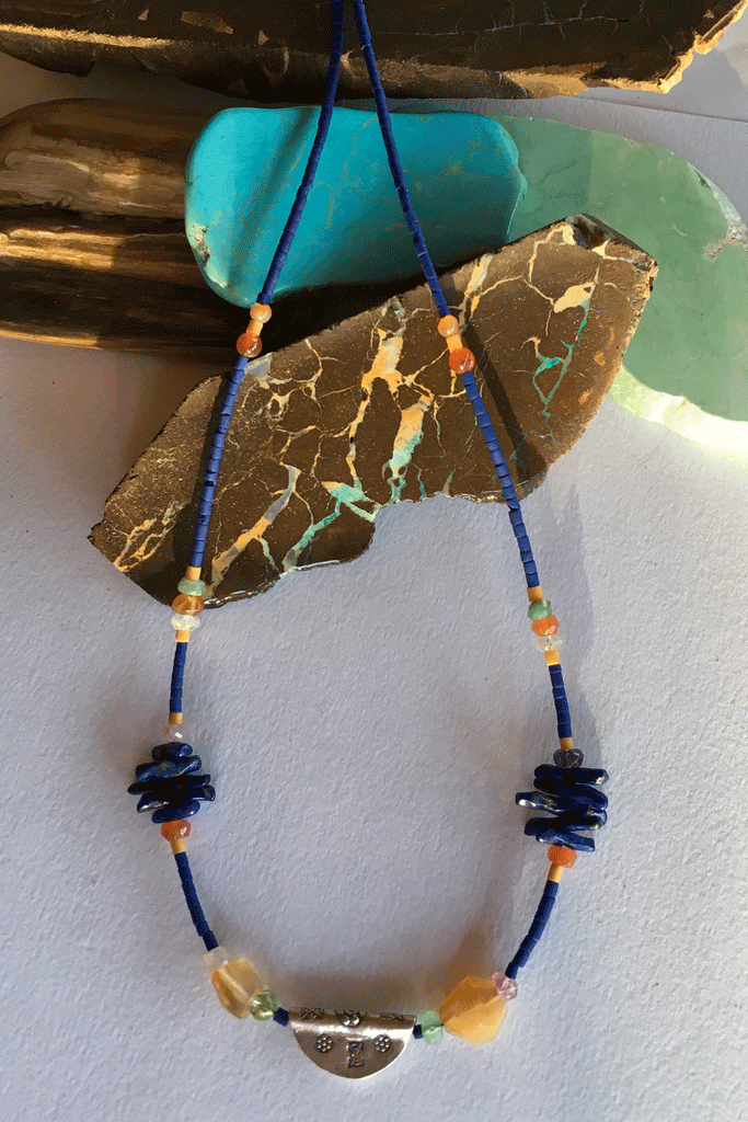 Necklace Cay Amulet with Lapis Lazuli is 40cm in length Beads include Lapis Lazuli, carnelian, faceted semi precious stone and Turkish glass beads.