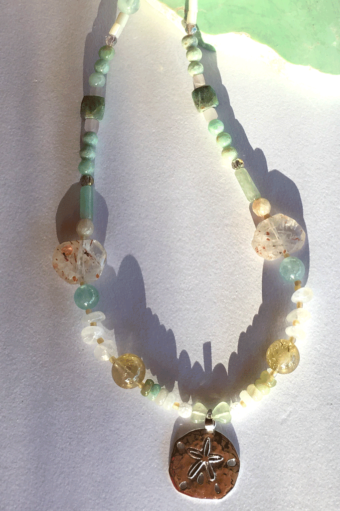 Pretty gemstone necklace with natural gemstones. Perfect to wear with chic boho luxe clothing an exclusive design