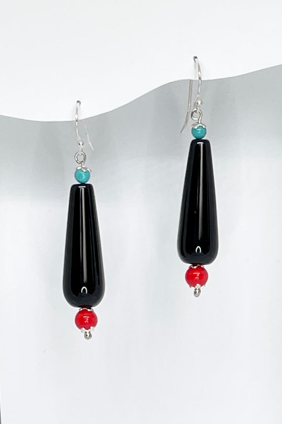 The Earrings Rock Droplet  have a water drop shaped  shiny black bead with a red and a turquoise highlight.