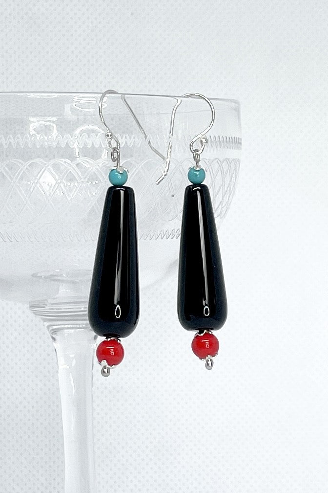 The Earrings Rock Droplet  have a water drop shaped  shiny black bead with a red and a turquoise highlight.