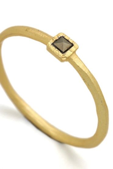 A very unusual and interesting ring, the band has a carved geometric effect and is set with a bright sparkling marcasite stone. 