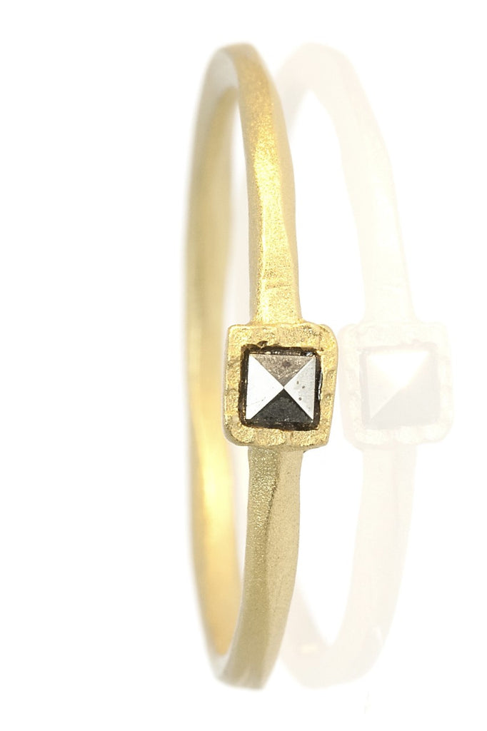 A very unusual and interesting ring, the band has a carved geometric effect and is set with a bright sparkling marcasite stone. 